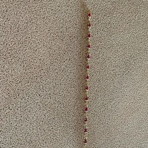 Ladies 7 1/4 inch ruby and diamond tennis bracelet